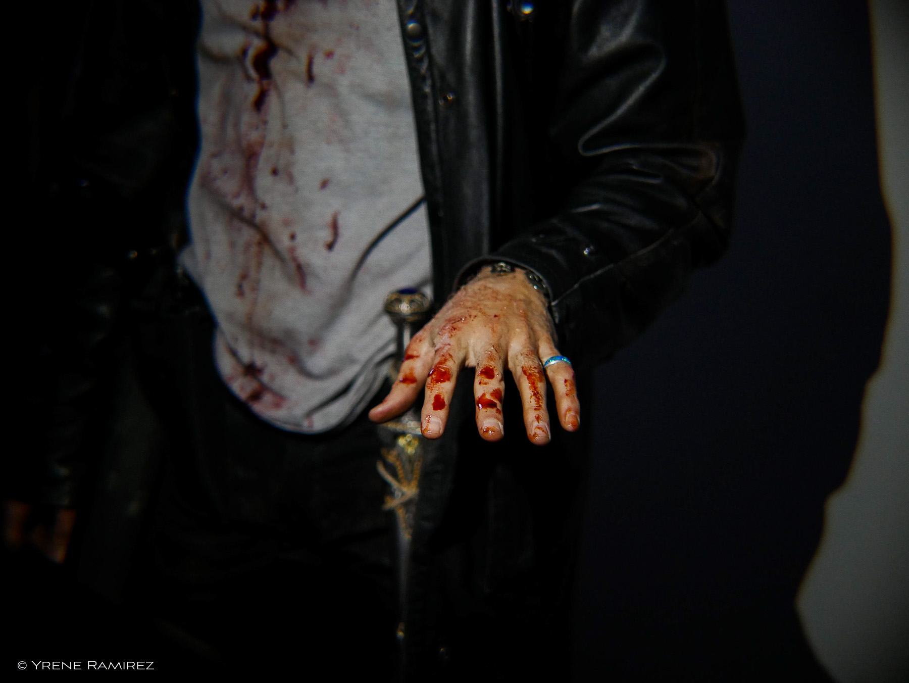 Harry's bloodied shirt and hands. Whoops, that ring shouldn't be there!